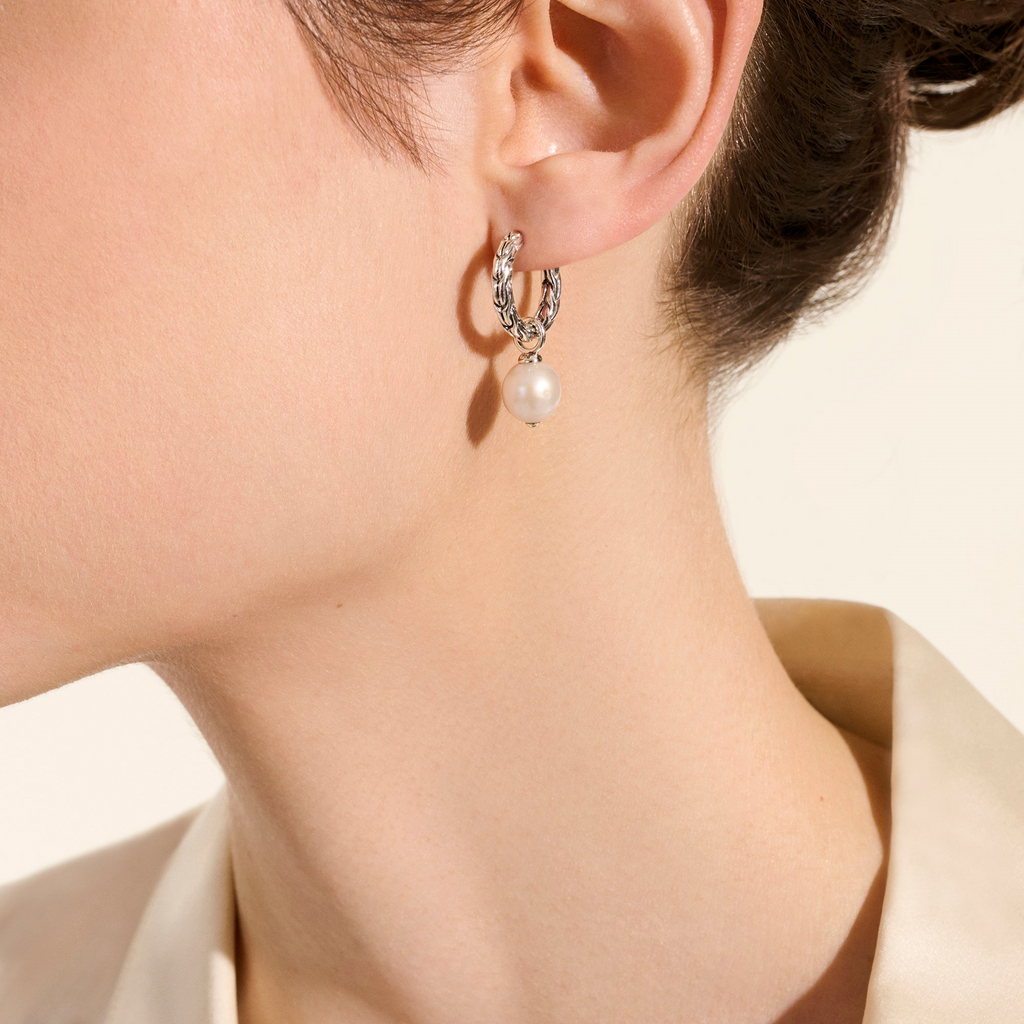 Sterling silver hoop earrings with pearls.
