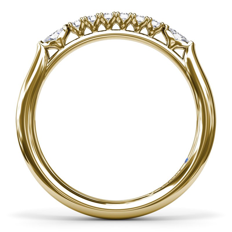 Yellow gold band with various shaped diamonds.