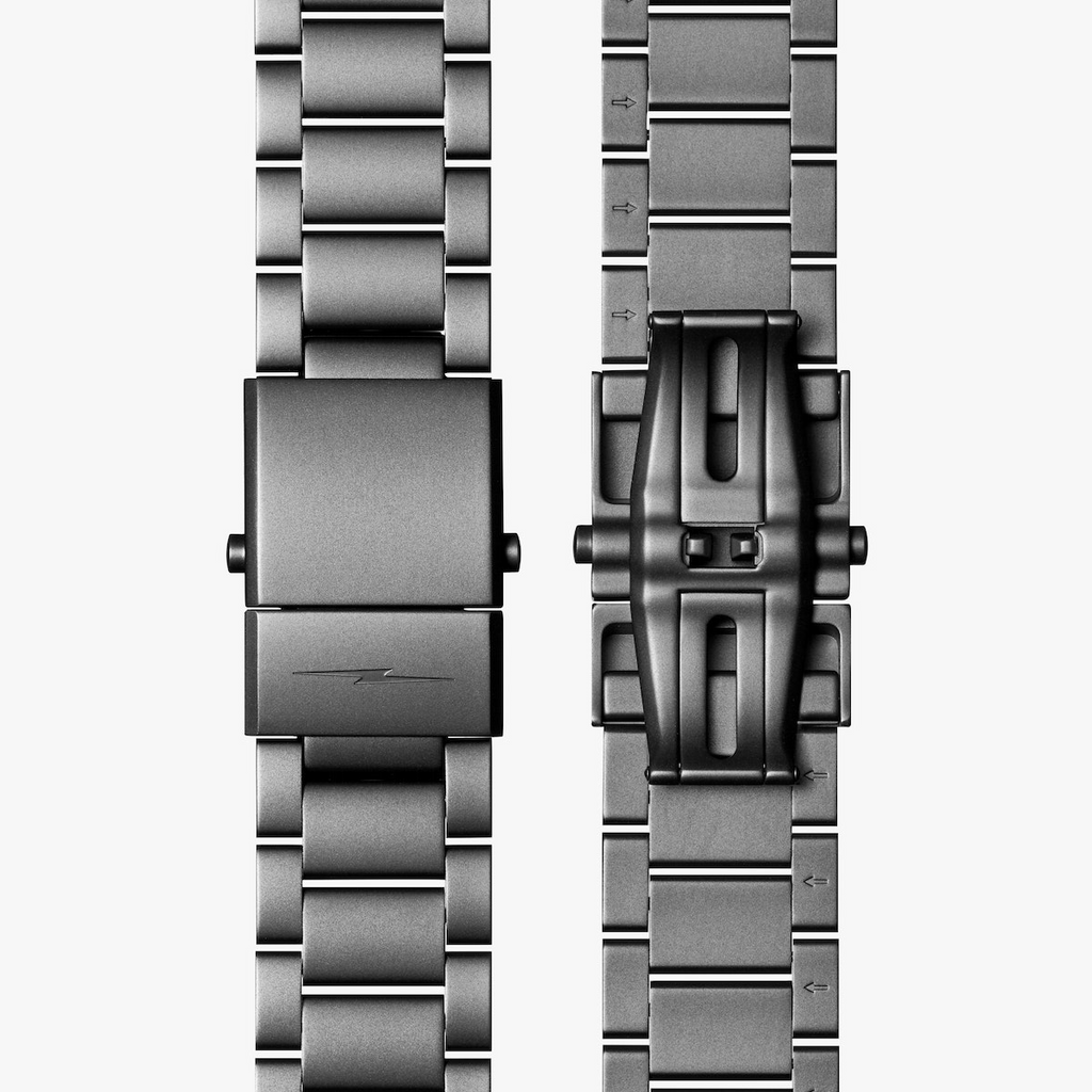 Stainless steel watch bracelet clasp detail.