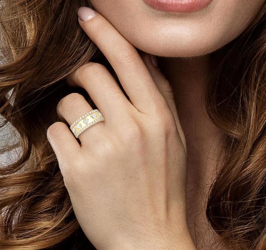 Yellow gold ring with various shaped diamonds.