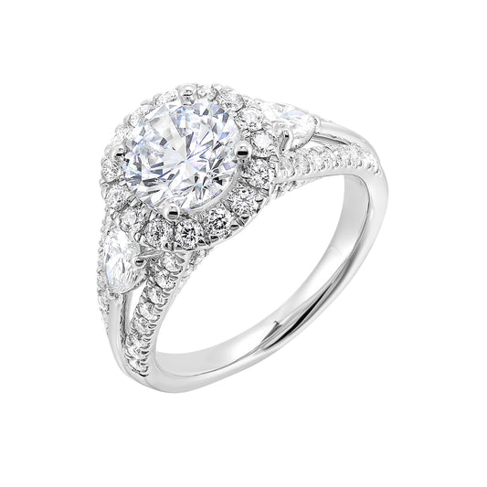 Halo three-stone diamond ring in white gold.