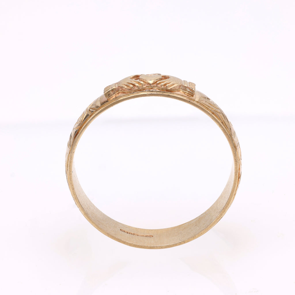 14K yellow gold carved band, intricate design.
