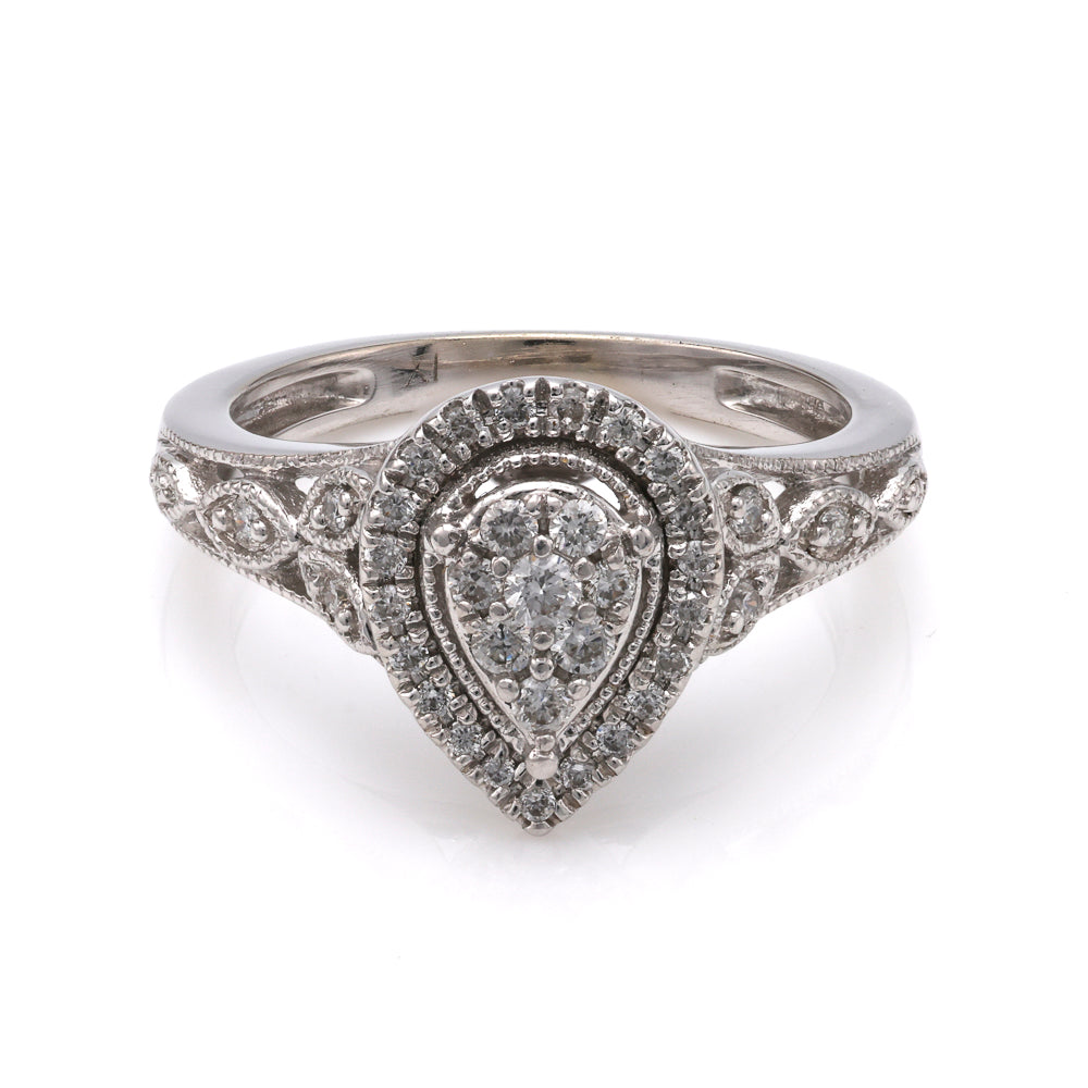 Pear-shaped diamond cluster ring in white gold.