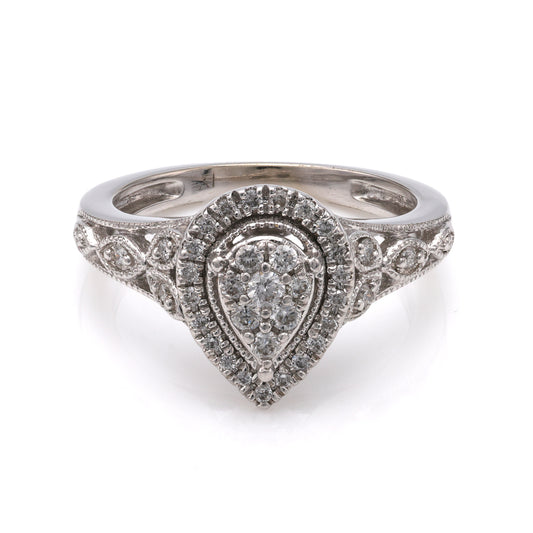 Pear-shaped diamond cluster ring in white gold.