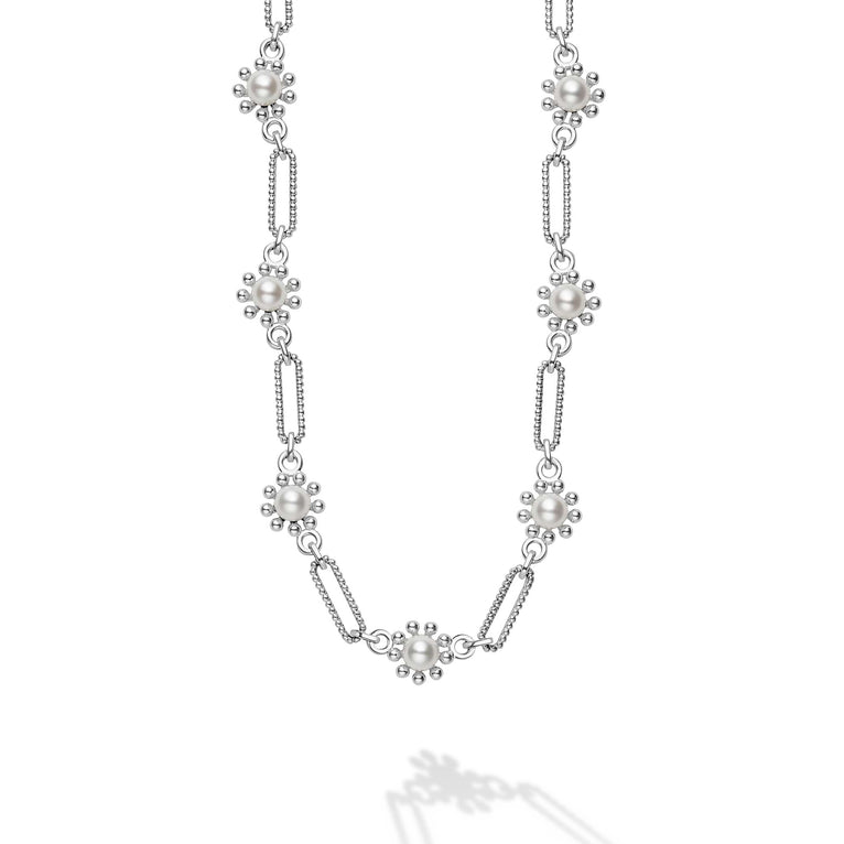 Sterling silver necklace with white pearls.
