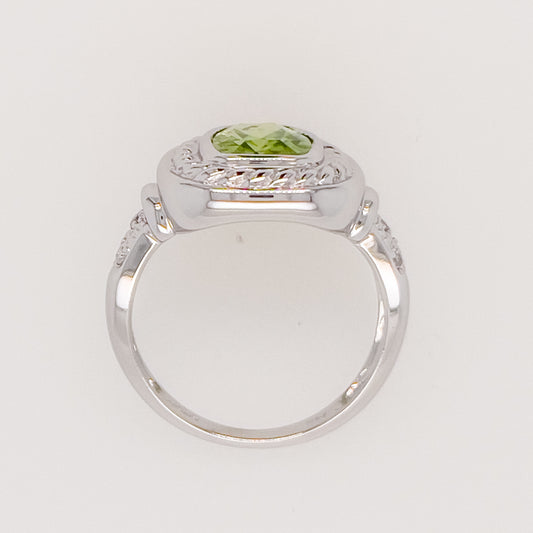 14K white gold ring with green gemstone.