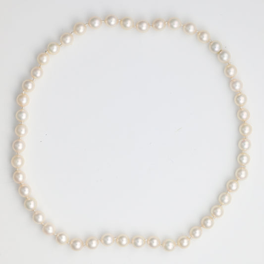 Cultured white pearl necklace strand.