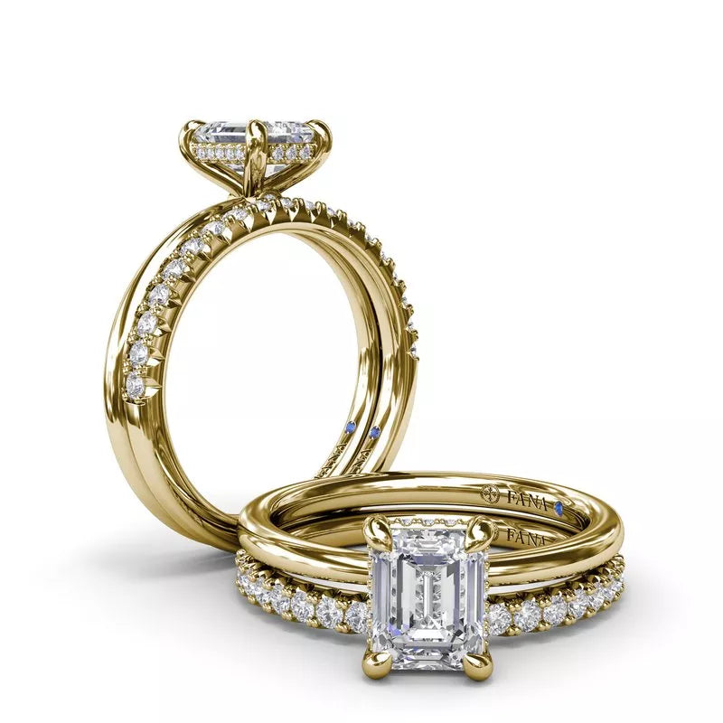 Yellow gold ring with round diamond accents.