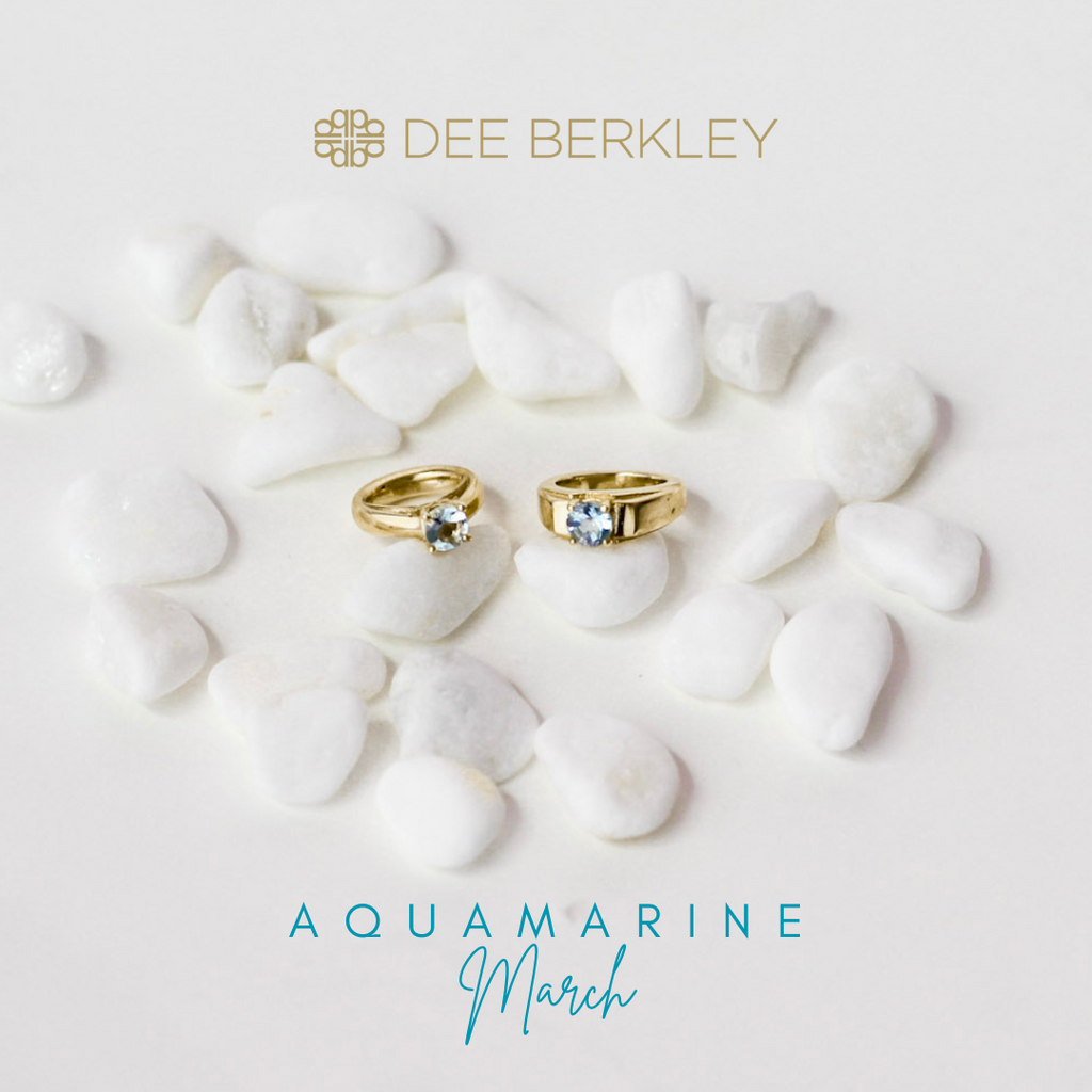 Gold rings with aquamarine stones.