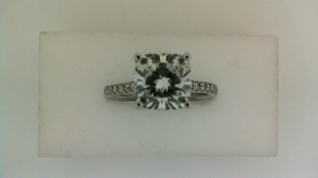 Cushion-cut diamond engagement ring in white gold.