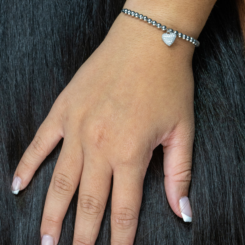 Sterling silver bracelet with heart charm.