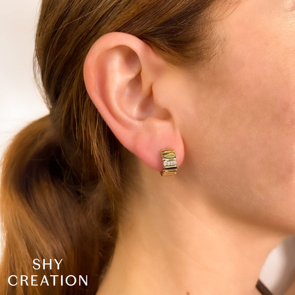 14K yellow gold huggie diamond earrings.