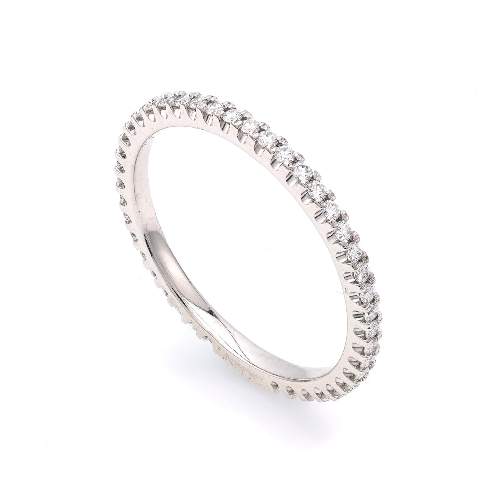 Platinum band with round diamonds.