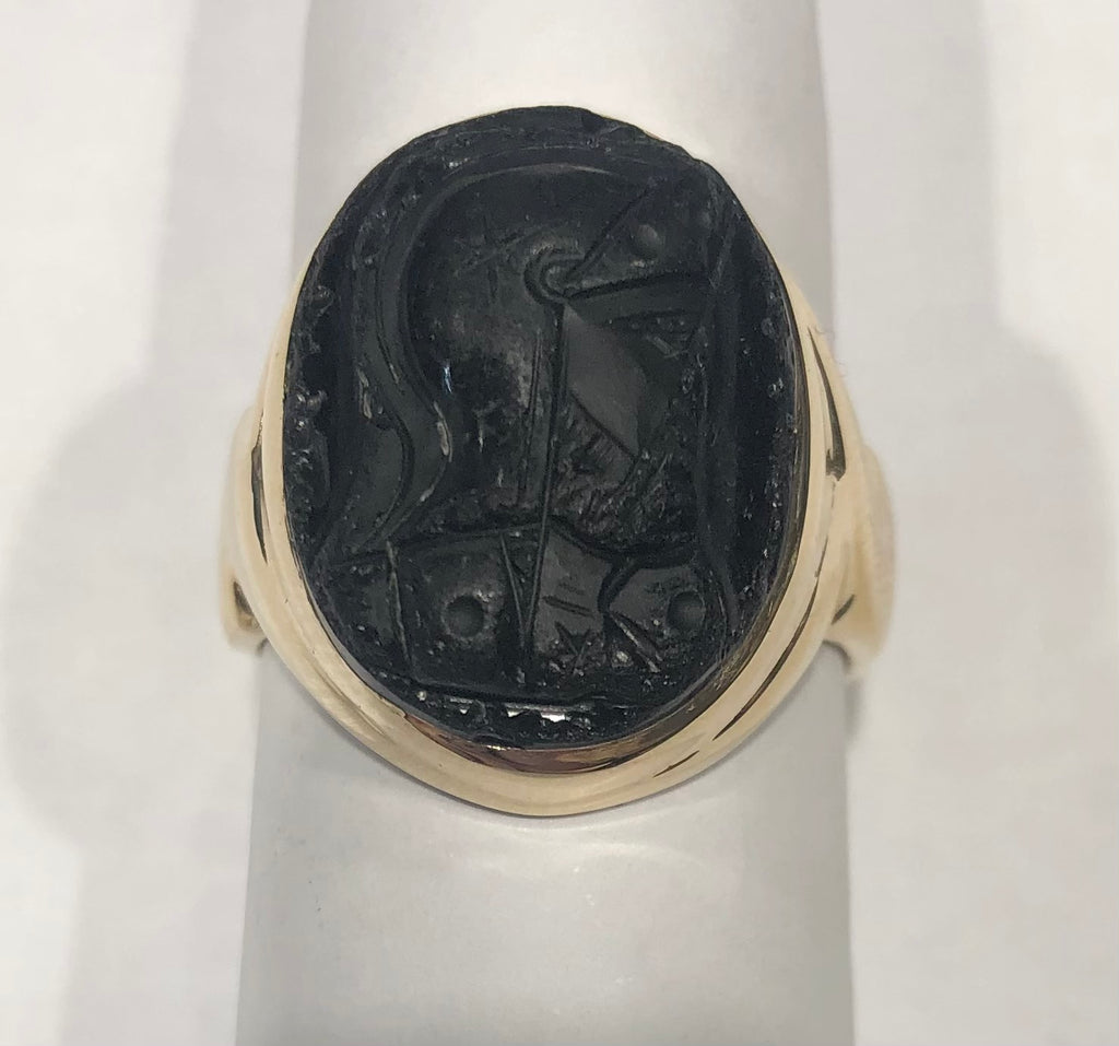 Engraved black gemstone ring, yellow gold band.