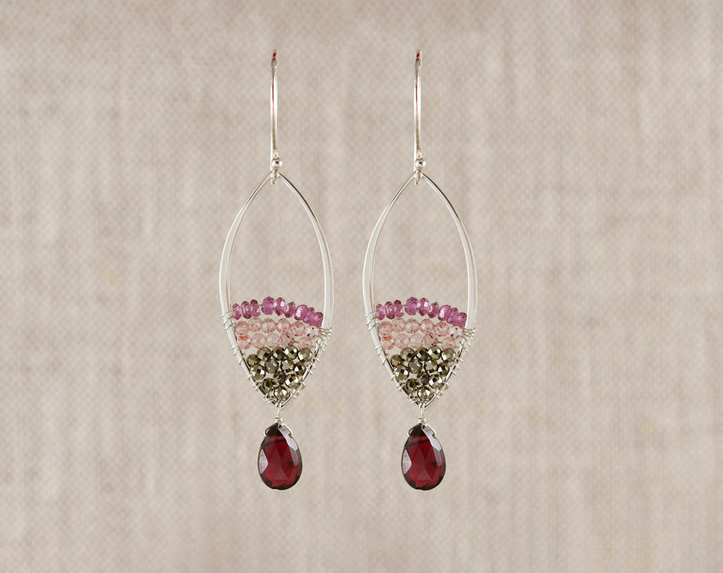 Sterling silver dangle earrings with gemstones.
