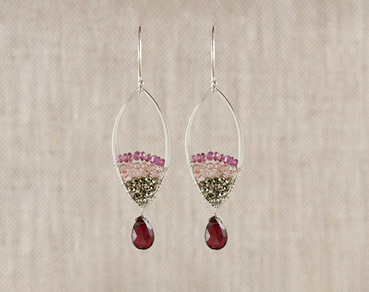 Sterling silver dangle earrings with gemstones.