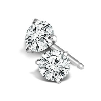 Round diamond stud earrings in white gold.