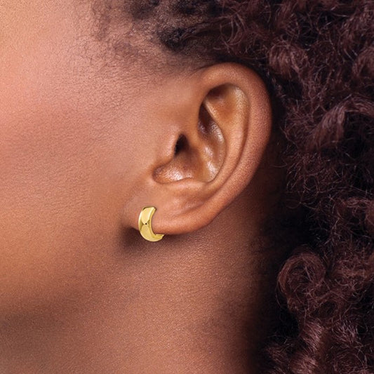 14K yellow gold Huggie earrings.