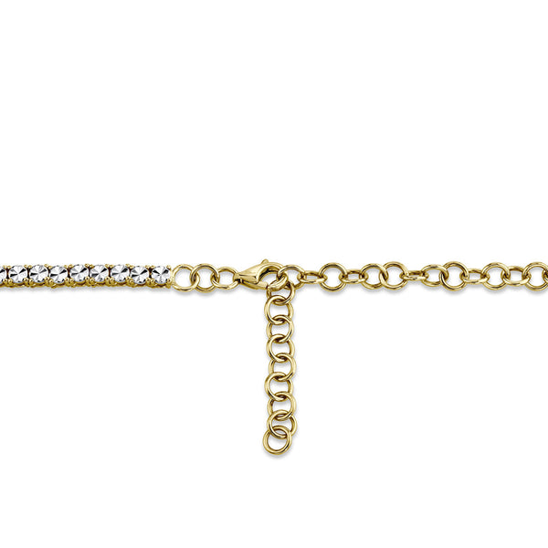 Gold chain necklace with diamond accents.
