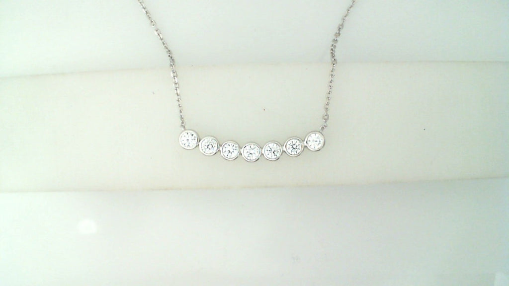 Bar necklace with round simulated diamonds.