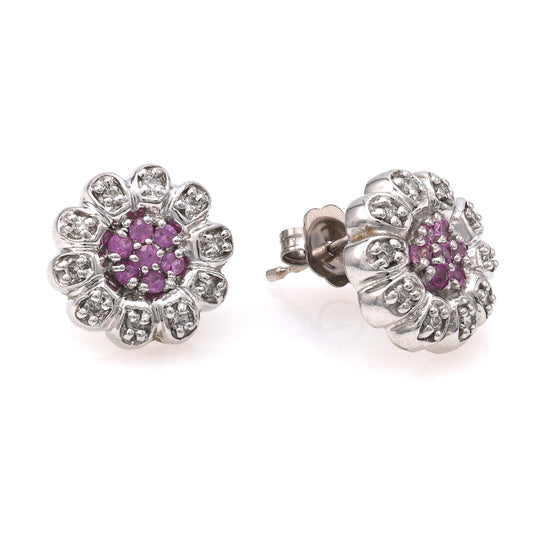 Pink sapphire and diamond floral stud earrings.