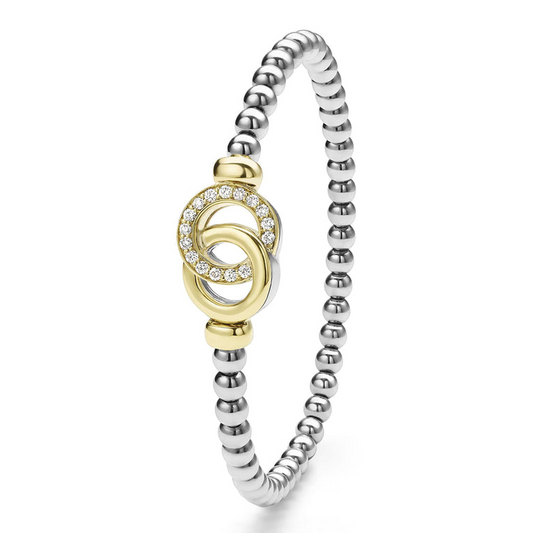 Sterling silver bracelet with gold accents.