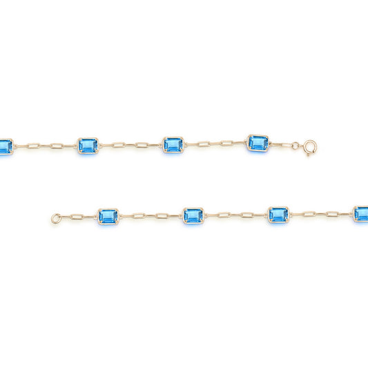 Emerald Blue Topaz paperclip bracelet in yellow gold.