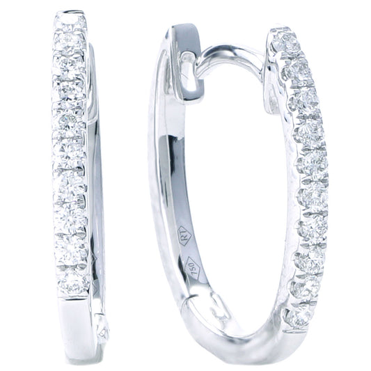 Medium white gold diamond hoop earrings.
