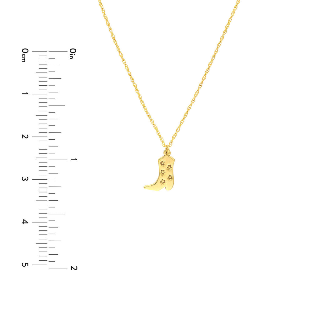 Yellow gold boot pendant with star cutouts.