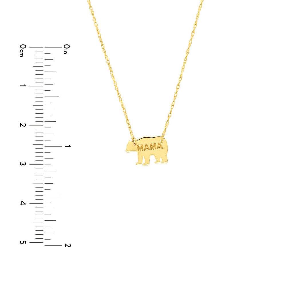 Yellow gold necklace with bear pendant.