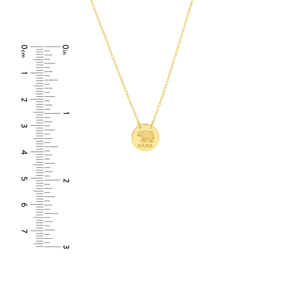 Yellow gold necklace with engraved bear pendant.