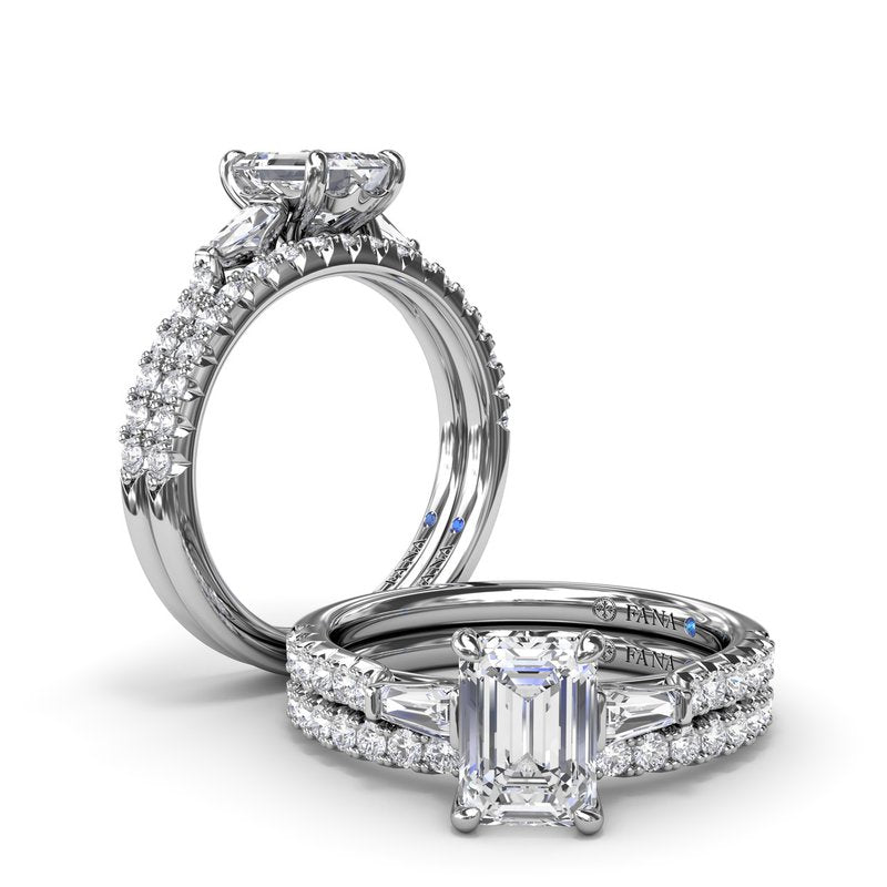 Three-stone diamond ring, white gold, hidden accents.