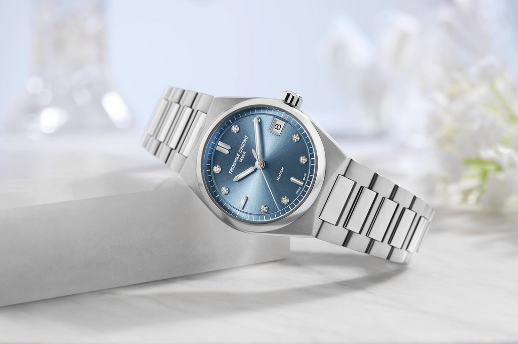 Blue dial stainless steel watch with diamonds.