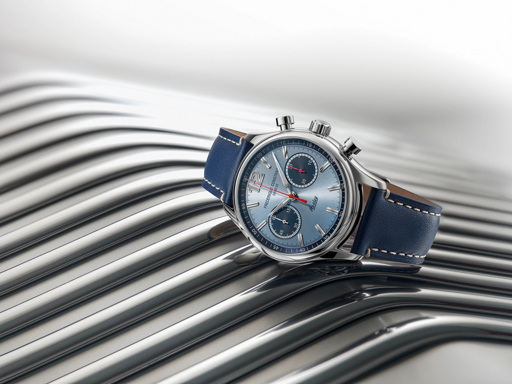 Light blue dial, stainless steel case, blue strap.