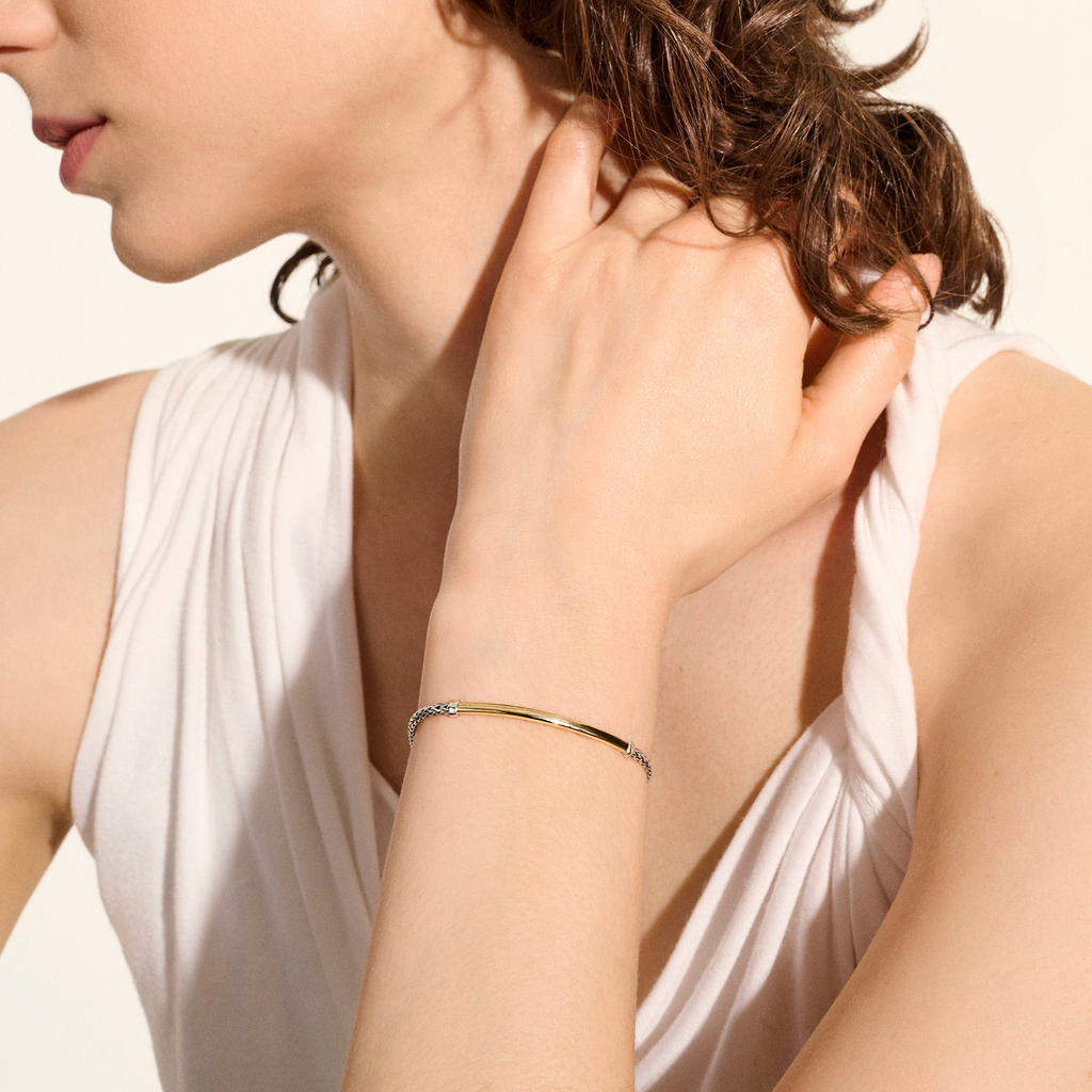 Sterling silver and gold station bracelet.