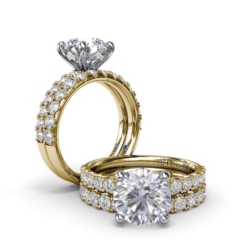 White-yellow gold ring with round diamonds.