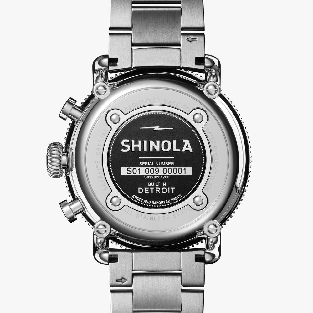 Stainless steel watch back with engraved logo.