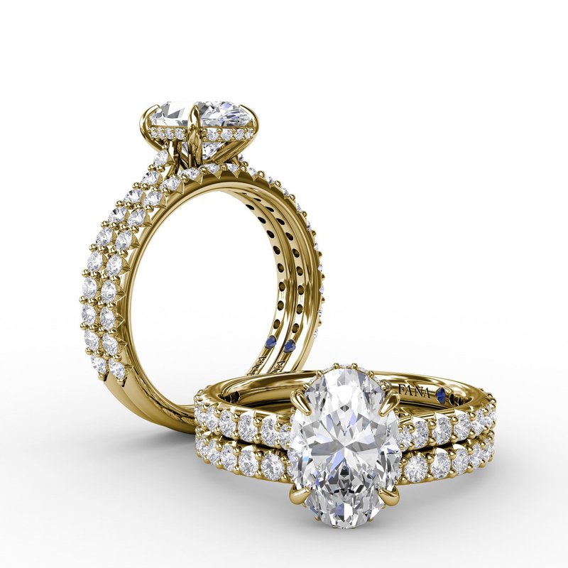 Yellow gold ring with round diamond accents.