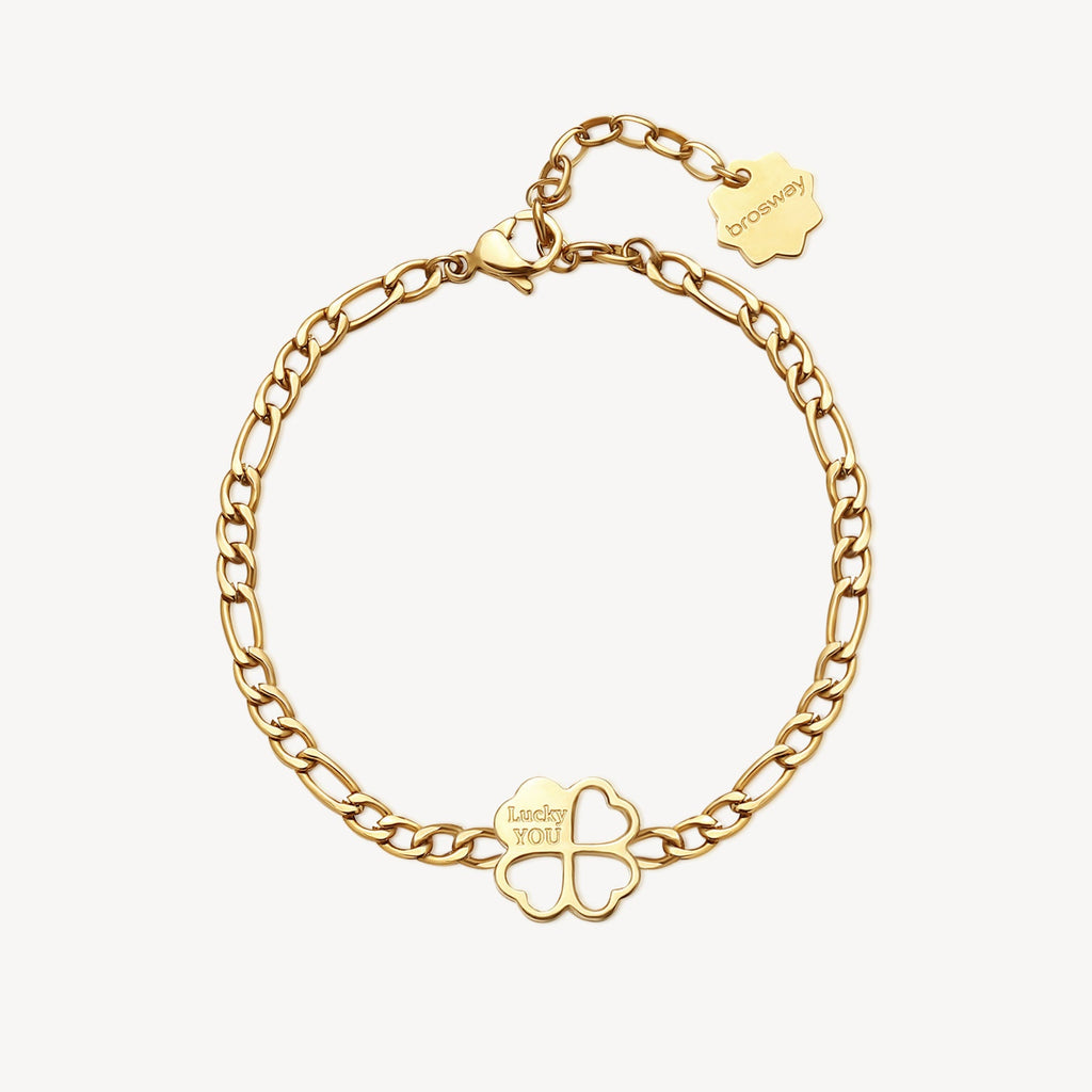 Yellow stainless steel bracelet with clover charm.