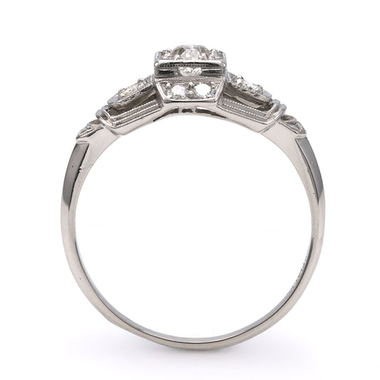 Platinum ring with three Old European diamonds.