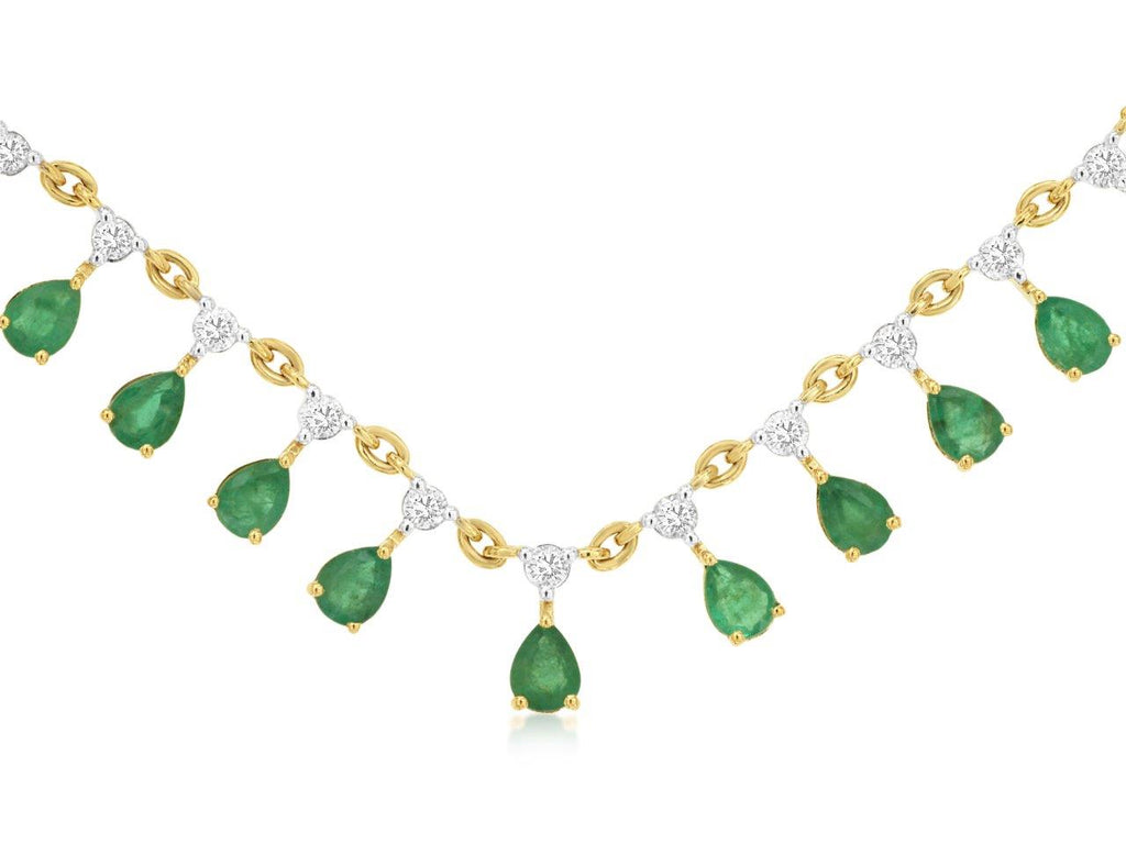 Pear emeralds necklace with yellow gold chain.
