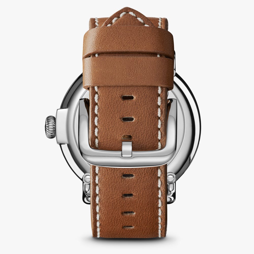 Brown leather strap, silver stainless steel buckle.