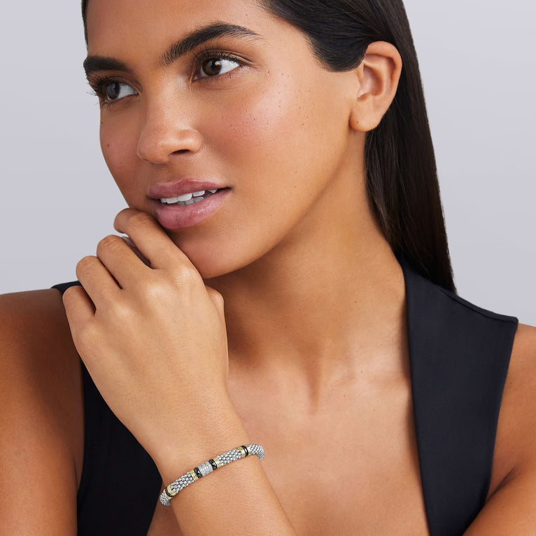Sterling silver diamond bracelet on wrist.