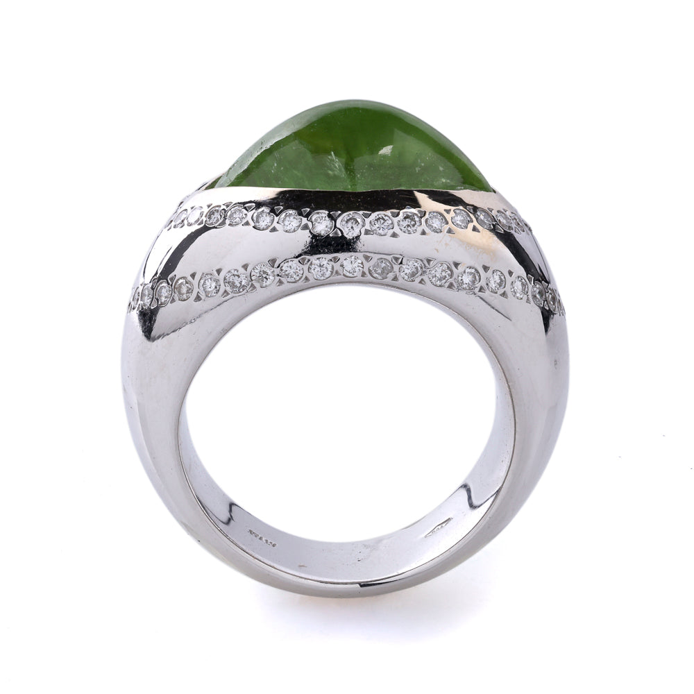 Peridot ring with diamond accents, white gold.