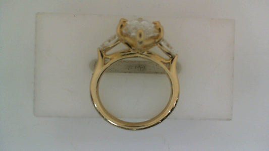 Three-stone yellow gold engagement ring.