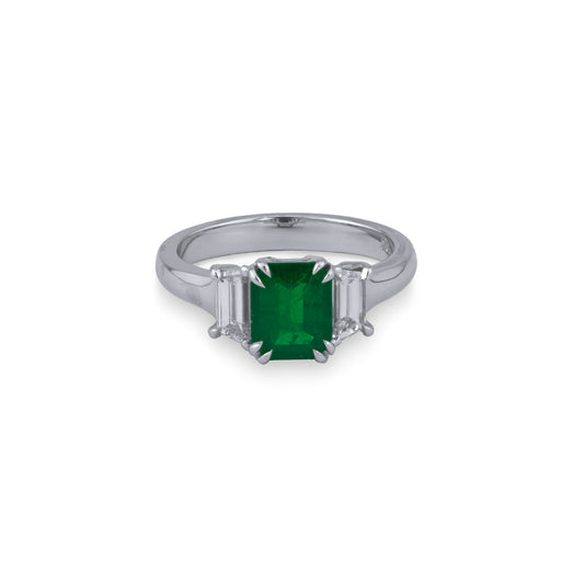 Emerald ring with trapezoid diamonds.