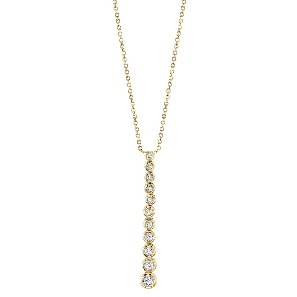 Diamond drop necklace in yellow gold.