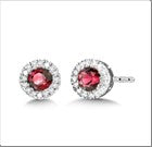 Ruby and diamond stud earrings in gold.