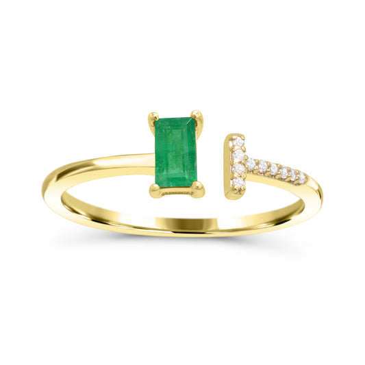 Emerald baguette ring with diamond accents.