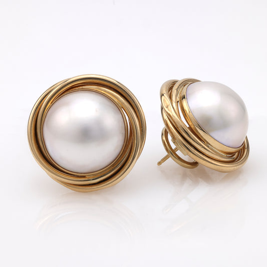 14K gold earrings with white Mabe pearls.